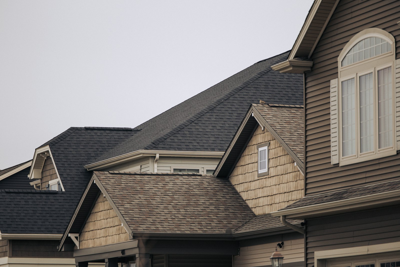 Rooflines of a Missouri suburban neighborhood with asphalt shingle roofs